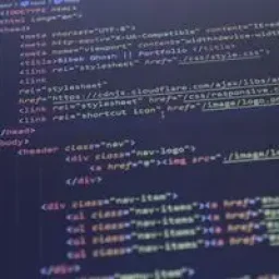 Close-up view of HTML and CSS code displayed on a computer screen, ideal for programming and technology themes.
